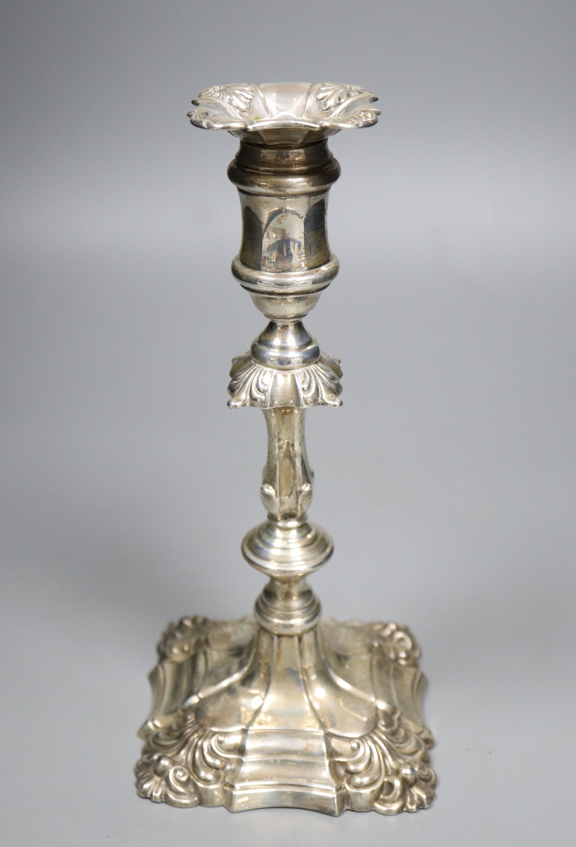 A late Victorian George III style silver candlestick, I.S. Greenburg & Co, Birmingham, 1900, weighted, 23.5cm.